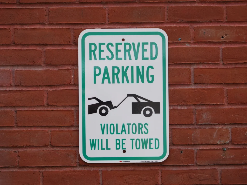 Custom parking and property signs for clear identification, directions, and access control.